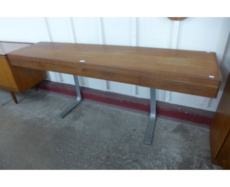 A  teak and chrome four drawer console table 