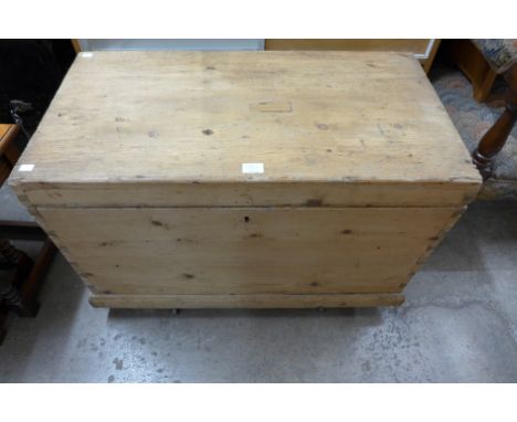 A large carpenter's pine tool chest with tools 