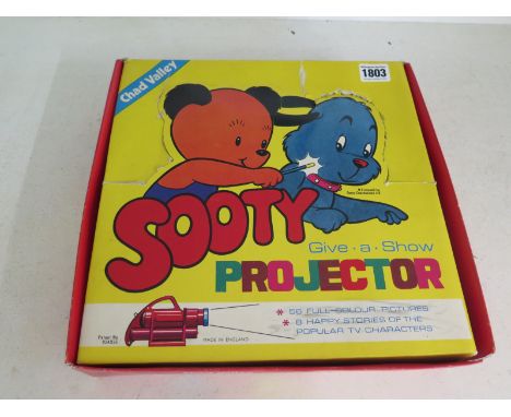 A rare Chad Valley Sooty Give a Show Projector, 1st type example with eight slide featuring fifty six stories 
Condition repo