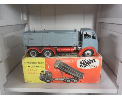 A Shackletons Foden FG6 mechanical scale model in original box
Condition report:  Missing clockwork motor and in play worn co