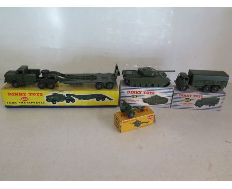 Dinky Toys no. 651 Centurion Tank, no. 622 10-ton Army Truck, no 686 25 pounder field gun and a Dinky Supertoys tank transpor