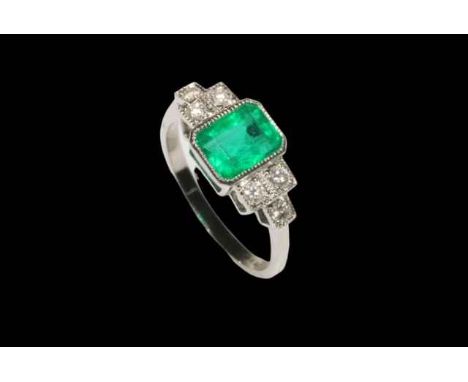 Emerald and diamond platinum ring, having approximately 1.25 carat emerald flanked by six brilliants, size M.