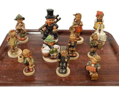 Collection of eleven Hummel figures.