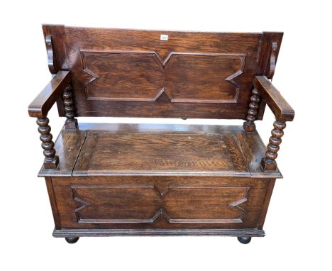 Oak Monks bench with bobbin pillars, 80cm by 105cm by 46cm (closed).