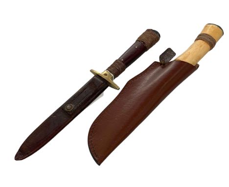 Knife in leather scabbard, overall 33cm, and Morakniv knife (2).