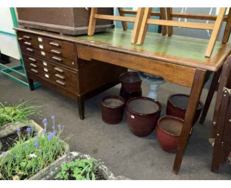 Oak six drawer plan chest-writing table and a collection of Ordnance Survey Maps, 89cm by 231cm by 94cm.