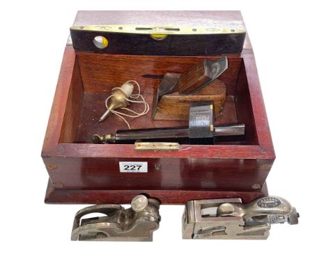 Box of vintage tools including planes, level, plumb bob and scribe.