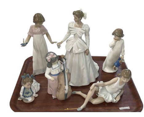Six Nao figurines.