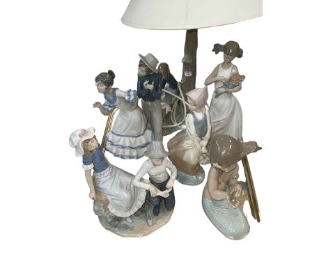 Six Nao figure and groups including table lamp.