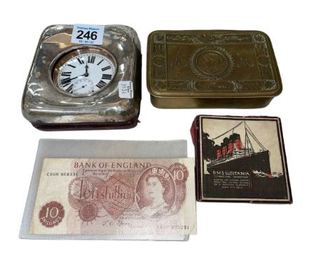 Silver easel watch case with keyless watch, Lusitania medal, 10 Shilling note, Princess Mary box, coins.