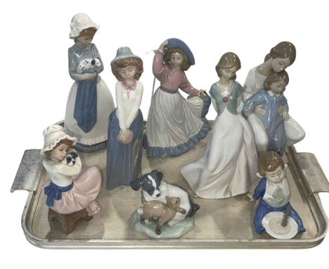 Eight Nao figurines.