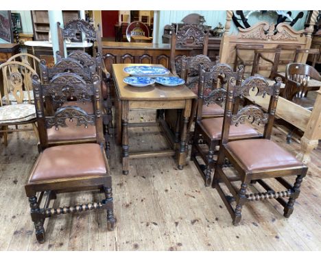 Large oak gate leg dining table, 74cm by 62cm by 123cm (leaves down), together with a set of eight carved oak dining chairs i