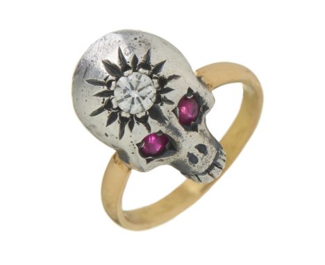 A silver and 18ct gold, brilliant-cut diamond memento mori skull ring, with circular-shape ruby eyes, diamond estimated weigh