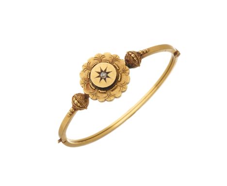 A late Victorian 15ct gold old-cut diamond hinged bangle, with cannetille and bead accent sides, stamped 15C, inner diameter 