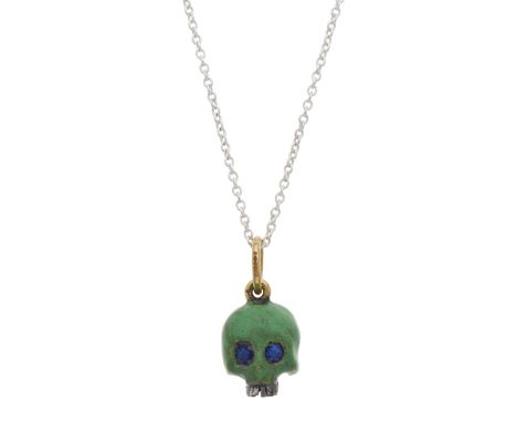 A silver and 18ct gold, green enamel memento mori skull pendant, with circular-shape sapphire eyes, suspended from a silver c