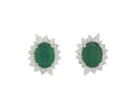 A pair of 18ct gold oval-shape emerald and vari-cut diamond cluster earrings, estimated total emerald weight 3.80ct, estimate