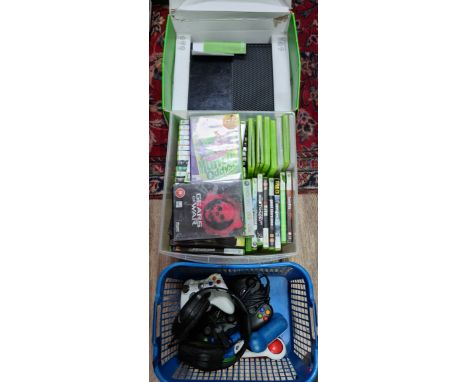 A box containing a collection of Xbox 360 games, an Xbox one console and a basket of accessories.  