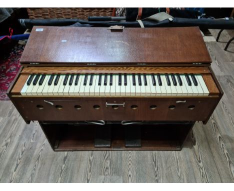 A folding harmonium, early 20th century, marked 'The Triumph de Lure, by the Salvationist publishing &amp; supply Co. Kings C