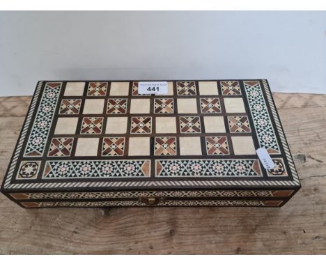 A Middle Eastern bone inlaid backgammon / chess game set with inlaid counters, no chess pieces.Condition report - The box is 