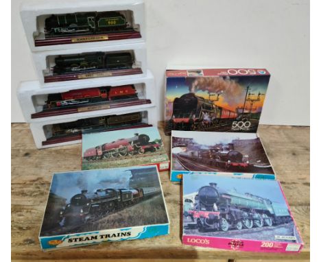 4 steam engine models on plinths and 5 jigsaw puzzles of steam trains - all jigsaws complete