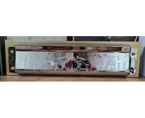 A large M. Hohner shop display model mouth organ, width 71cm.Double sided with 2 mounting holes on the bottom