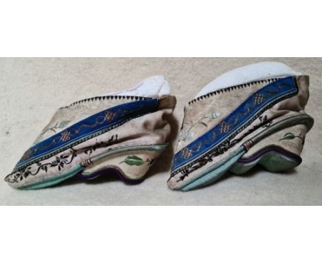 A pair of antique Oriental embroidered silk shoes for bound feetDelivery for this item would be £18+VAT (UK only).