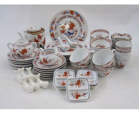 20th century Chinese porcelain dinner and tea service, iron-red and blue flowering branch decoration with diaperwork, pomegra