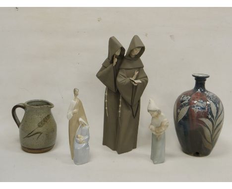 Collection of studio stoneware and Lladro figures, comprising a studio pottery lamp base decorated with leaves and flowers in