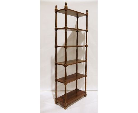 20th century mahogany six-shelf bookcase, the shelves united by turned fluted supports, moulded feet, 199cm x 71cmCondition R