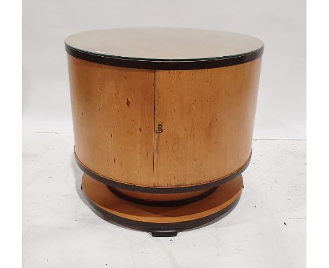 In the manner of Ray Hille, circa 1930, Art Deco cocktail cabinet of circular form, veneered in bird's eye maple, the hinged 