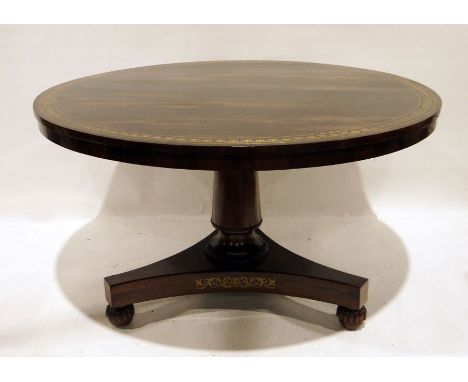 19th century rosewood breakfast table, the circular top with brass inlay, on circular column to triform base, turned and reed