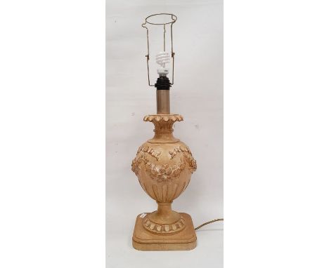 Italian carved wood table lamp, urn shaped with everted rim above ovoid body, all carved with floral swags, on square plinth 