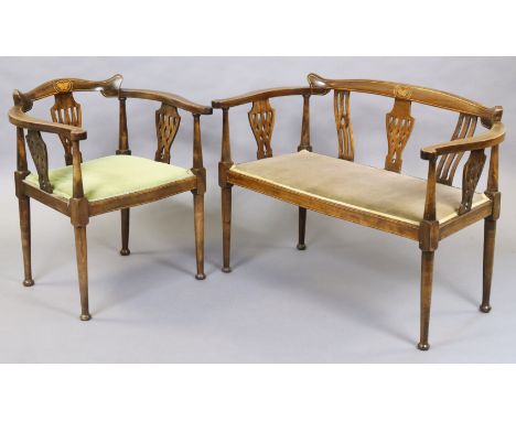 An Edwardian show-wood sofa &amp; matching elbow chair, each with pierced splat backs, shaped supports &amp; padded seats, on
