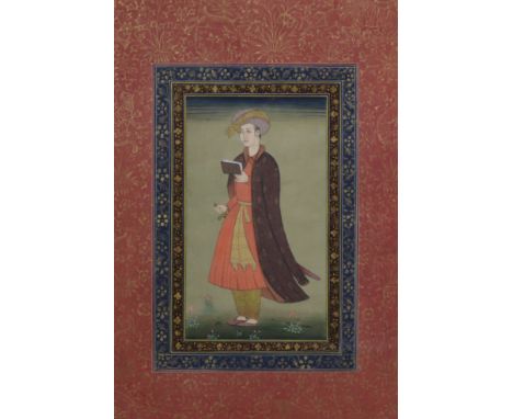 MOHANLAL SONI (20th century), An Indian gouache miniature portrait of a young man holding a manuscript, heightened with gilt 