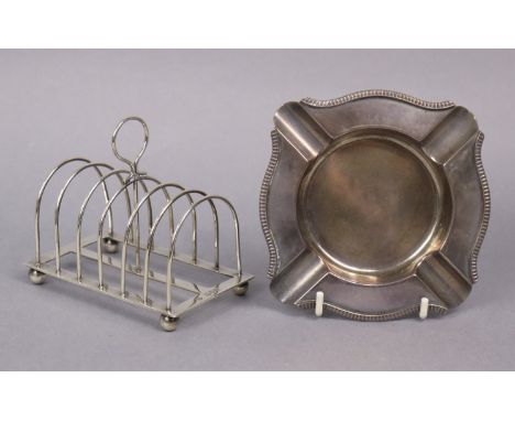 A Victorian silver six-division toast rack on ball feet, 11cm wide, London 1895, by W. S. Hutton; &amp; an ashtray with gadro