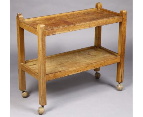 A Robert “Mouseman” Thompson oak two-tier tea trolley, each rectangular tier with raised edge &amp; on square supports with c