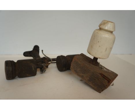 Early ceramic telephone insulator together with a double insulator