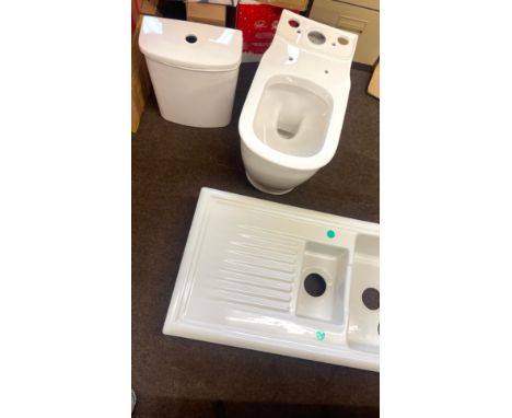 Brand new toilet cistern, white ceramic kitchen sink, sink measures approximately Length 40 inches, Width 21 inches