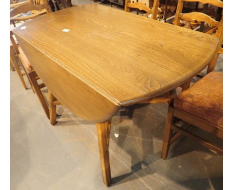 Circular dropleaf Ercol dining table 