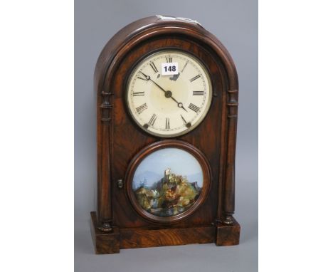 A 19th century walnut mantel clock, with painted glass panel and Roman dial Height 44cm