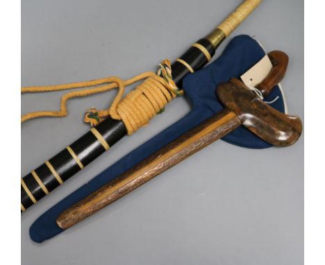 A Chinese Dao sword with rope-bound brass-ended grip and ebonised scabbard and a decorative Kris-type dagger with wavy blade 