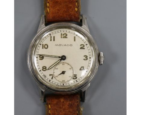 A gentleman's 1940's stainless steel Movado mid size manual wind wrist watch.