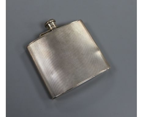 A George VI engine turned silver hip flask, A. Wilcox, Birmingham, 1939, 11cm.