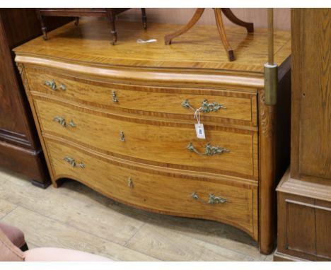 A Continental satinwood serpentine commode W.138cm