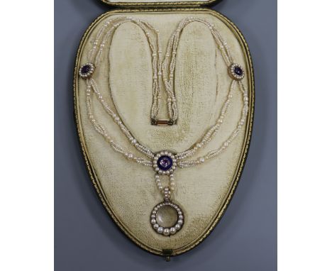 A Regency gold, enamel and amethyst set multi strand seed pearl necklace, with split pearl set glazed mourning? pendant, in f