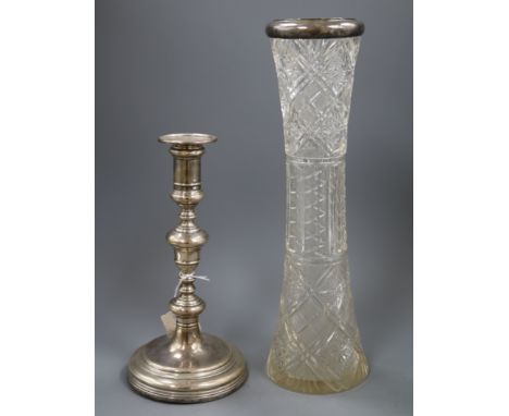 A 1920's silver candlestick and a late Victorian silver mounted tall glass vase.
