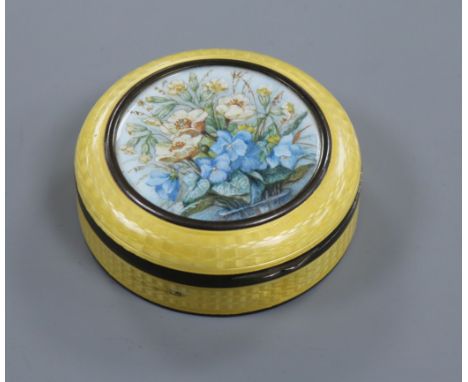 An early 20th century silver and enamel circular box and cover with central painted floral panel, import marks for Erich Kell