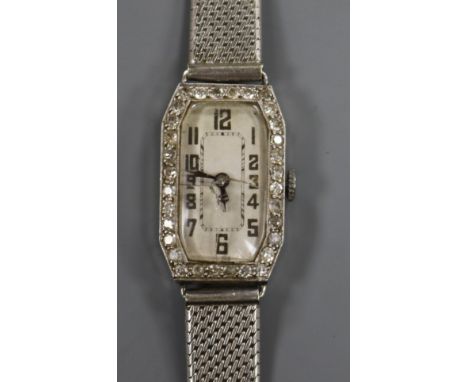 A lady's platinum and diamond set manual wind cocktail watch, on a 9ct white gold mesh bracelet.