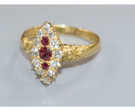 An early-mid 20th century 18ct gold, ruby and diamond marquise cluster ring, size M.