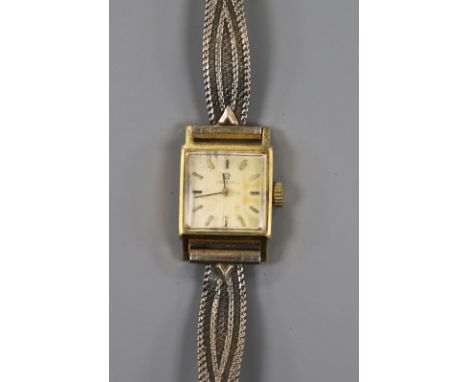 A lady's gold plated Omega manual wind wrist watch.